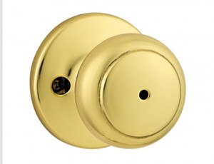Kwikset Interior Knob Cove in Polished Brass